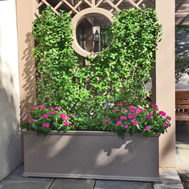 Brown Charleston planter with matching painted trellis display