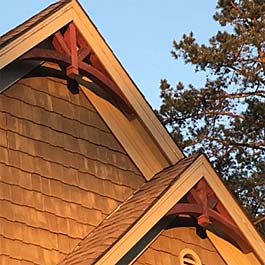 two red stained cedar gable arches 10/12 pitch