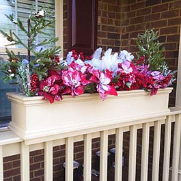 Winter artificial flower display for flower boxes on railings