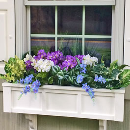 Blue delphiniums with white and purple peonies