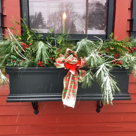 Christmas winter window box holly greens and xmas bow