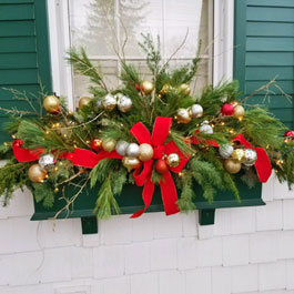 Christmas window box ribbon and pine needles