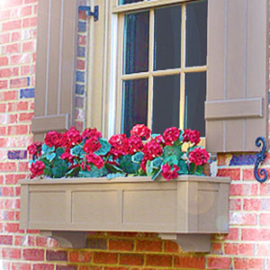 brown window box with red geraniums