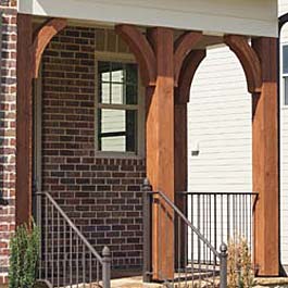 cedar brace arches in red stain