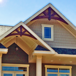 Dark stained cedar gable arches 10/12 pitch