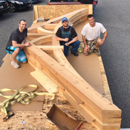 Construction team next to very large gable brackets!