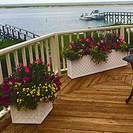 long lattice planters on curved back deck over looking lake