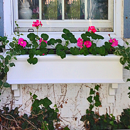 white traditional pvc window box with craftsman style bracket