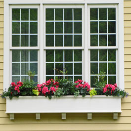 extra long window box with corbels underneath triple window