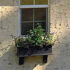 3' foot black window box on stucco