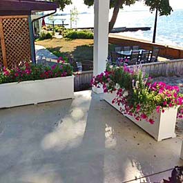 long, skiny planters defining boundaries of porch space