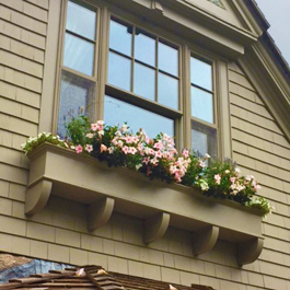 long custom window box installed atop rafter beams