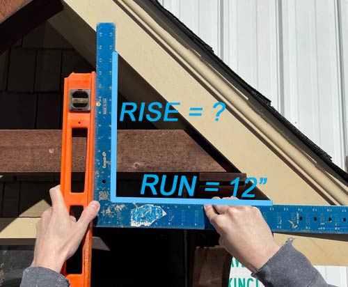 Measuring roof pitch with a builders square and a level