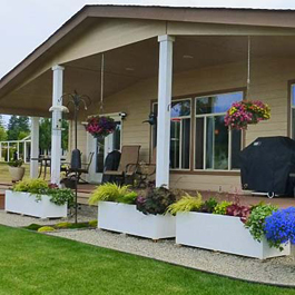 Large rectangular planters in front of house